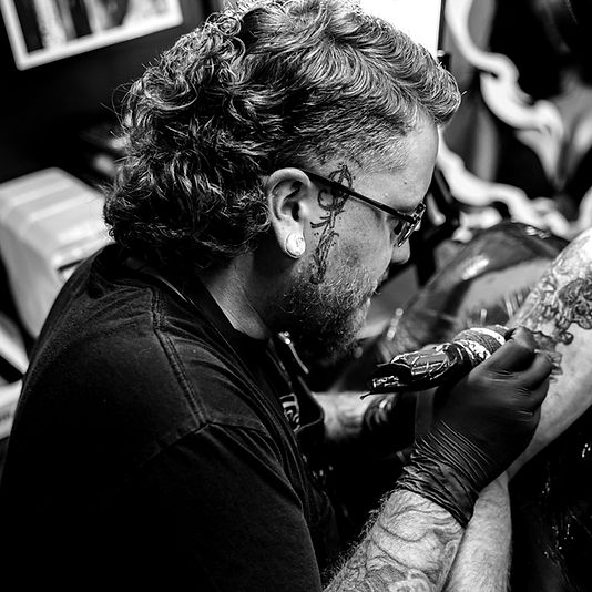 Book Tattoo Consultation Instagram: Step-by-Step Guide 7 Professional tattoo consultation discussion before booking through Instagram