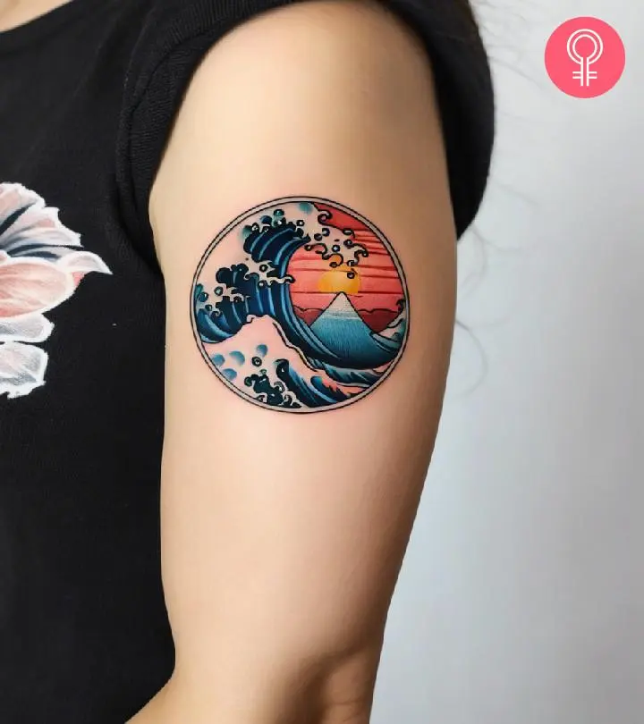 Wave Tattoo Design Meaning, Styles & Expert Guide 9 Wave tattoo on upper arm showing placement example