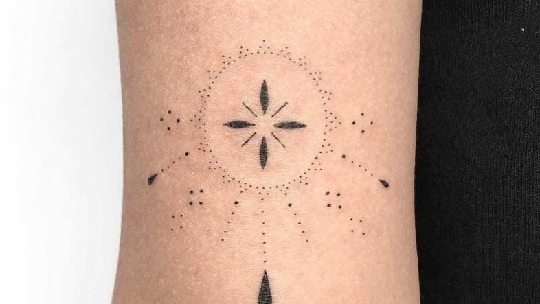 Hand Poked Tattoo Guide: Pain, Healing, Safety & Longevity Hand poked custom tattoo on the forearm