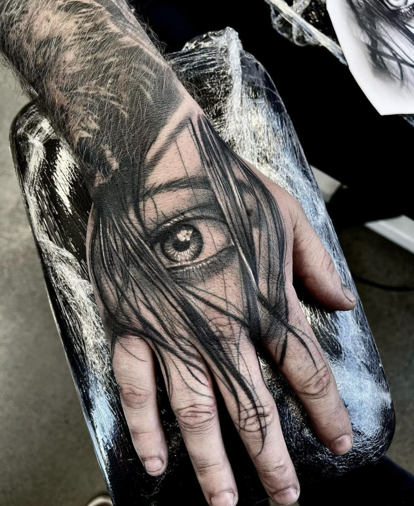 Photorealistic black and grey realism tattoo example