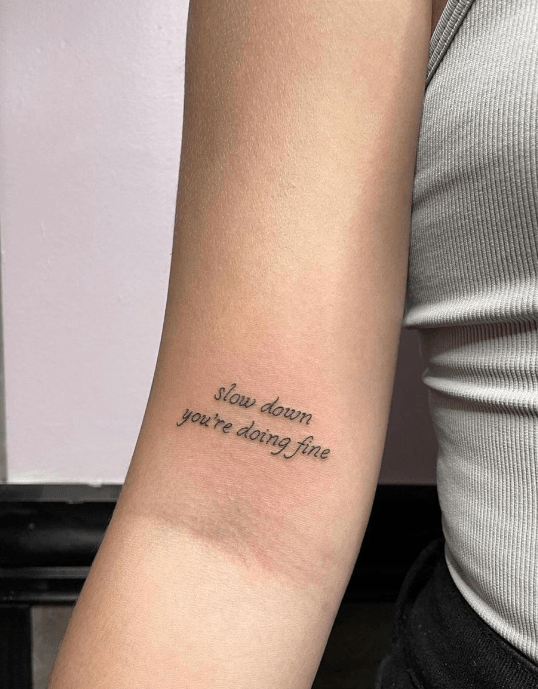 Quote Tattoos: Meaning, Designs, Fonts & Timeless Ideas Guide 5 Inspirational quote tattoo design example on skin