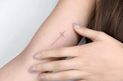 Minimalist Tattoo Ideas: Meanings, Designs & Expert Guide Tiny Minimalist Star on Women Arm Tattoo by ongarato tattoo Tattoobnb
