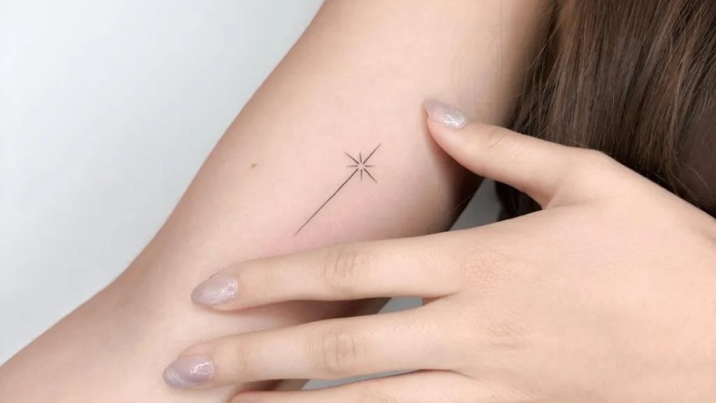 Minimalist Tattoo Ideas: Meanings, Designs & Expert Guide Tiny Minimalist Star on Women Arm Tattoo by ongarato tattoo Tattoobnb