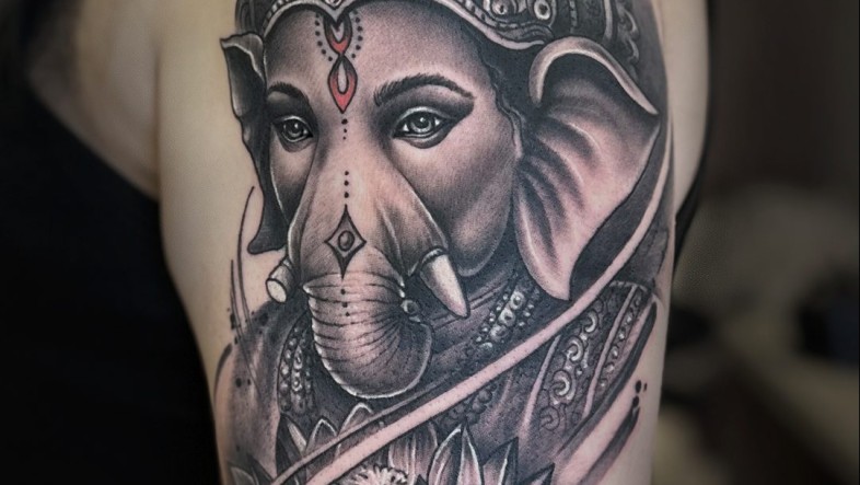 Ganesh Tattoo Meaning, Designs & Spiritual Symbolism Guide ganesha new tattoo e1737570087834