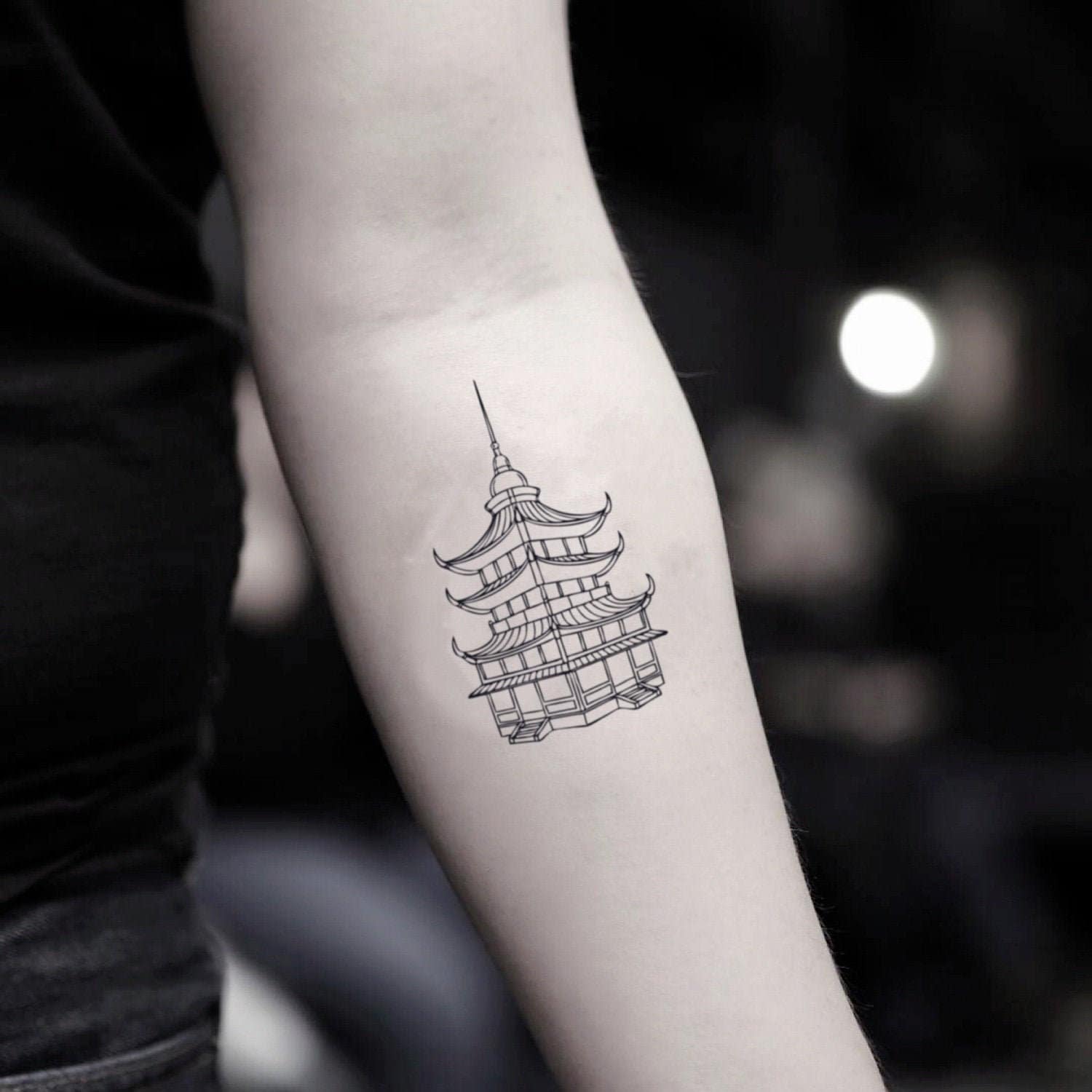 Pagoda Tattoo Meaning, Symbolism & Stunning Design Ideas 9 Detailed pagoda tattoo design inspired by East Asian culture