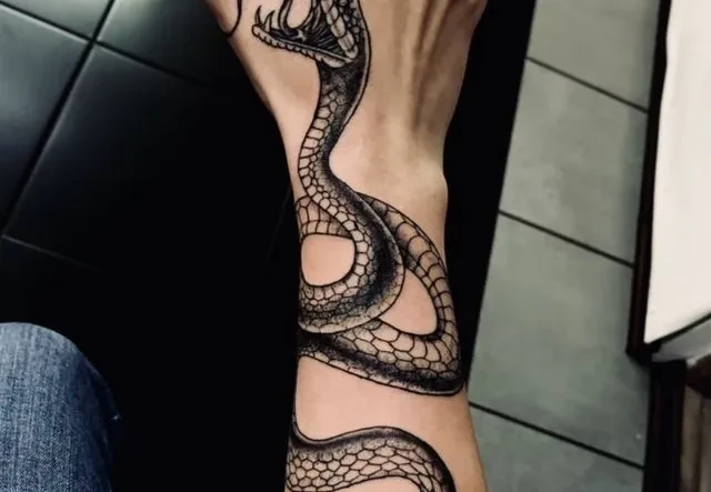 Snake Tattoo Meaning, Symbolism & Best Design Ideas snake tattoos 1