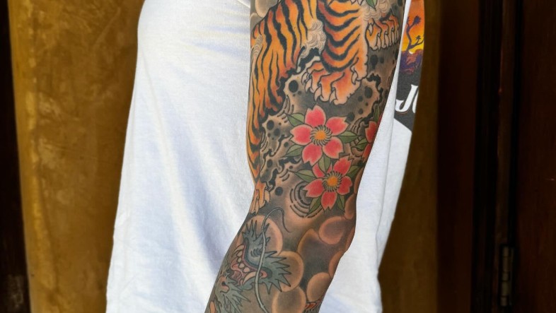 Asian Tiger Dragon Sleeve Tattoo: Meaning, Designs & Ideas tiger dragon sleeve by pete vaca at full circle tattoo v0 dnl5ijh48fdc1