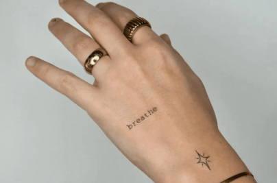 Minimalist Wrist Tattoo: Meaning, Style & Expert Guide wristtattoos d964677f838d4646b312bfa912b31a36